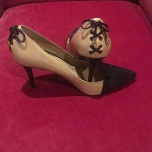 High heel shoes with lace up the back.